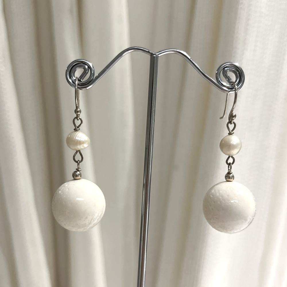 Earrings and a soft white. 
1 -3/4” Dangle pierced Earrings. Hypoallergenic.